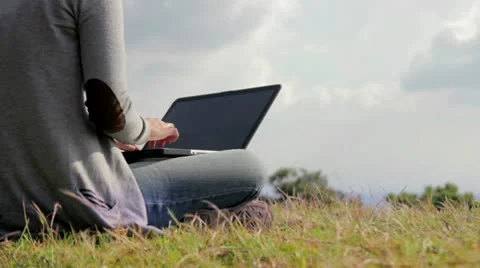 Working on laptop in the nature Video stock 9122092
