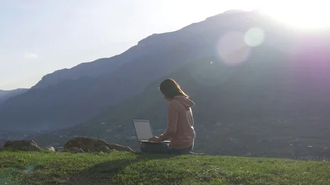 Working with a laptop in the open air Stock Footage 75496999