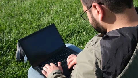 Working with laptop in park Stock Footage 196904175