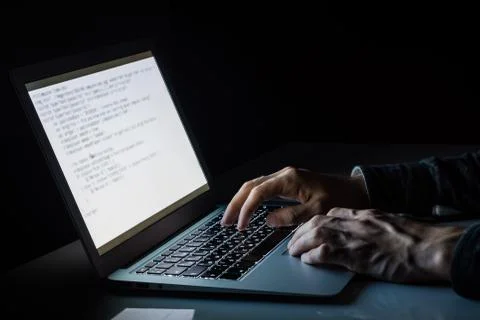Working at laptop pc at night.  Stock Photos