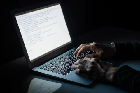 Working at laptop pc at night.  Stock Photos