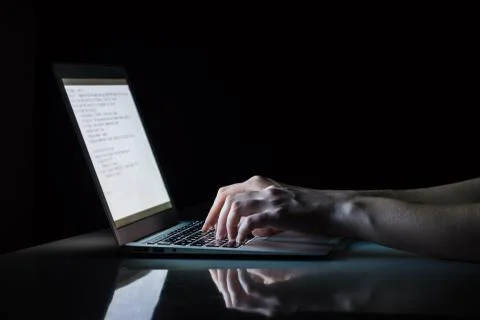 Working at laptop pc at night.  Stock Photos