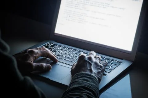 Working at laptop pc at night.  Stock Photos