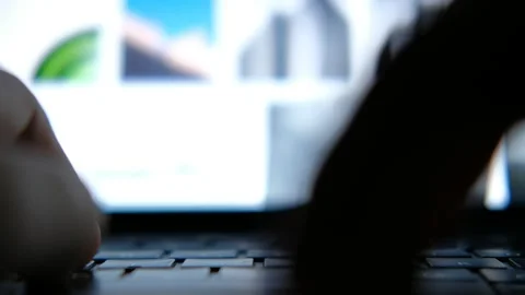 Working on a laptop with screen visuals close up Stock Footage 226955238