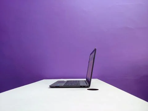 A working laptop on a table Stock Photos