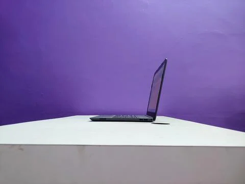 A working laptop on a table Stock Photos