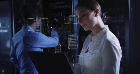 Working on laptop, woman with code snippets over data center background Stock Footage 327848083