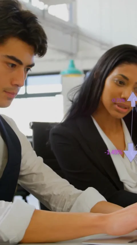 Working on laptops, business people processing financial data with animated Stock Footage 343091796