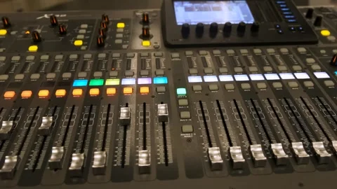 Working on a large sound mixer 動画素材 260965887