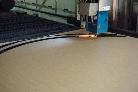 Working of laser cutting machine in cut the plastic sheet Stock Photos
