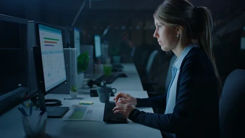 Working Late at Night in the Office: Businesswoman Using Desktop Computer Stock Footage