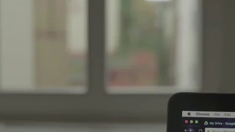 Working on a Mac Focus on Window 4K Stock Footage 69143599