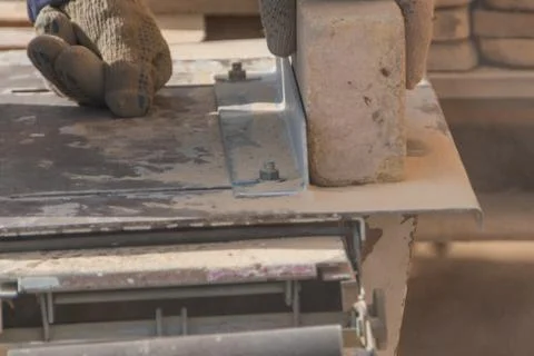 The working on the machine cuts the stone, laser disk Photos