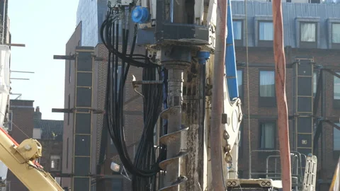 A working machine drilling a hole on the ground. Stock Footage 132737354