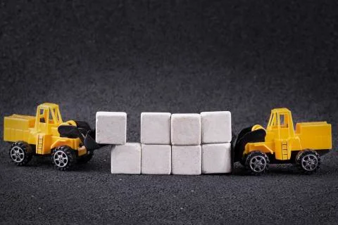 Working machine moving stone blocks Stock Photos