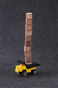 Working machine moving wooden blocks Stock Photos