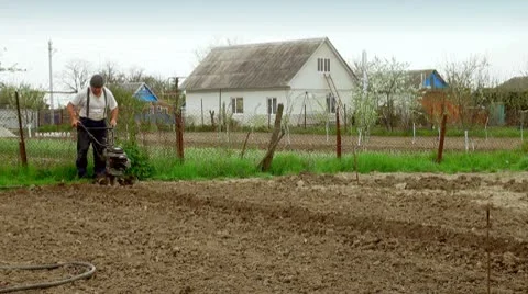 Working man with motor cultivator (life sound) Stock Footage