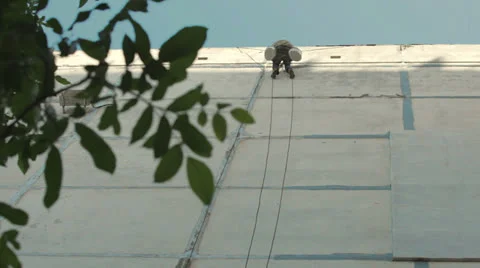 The working man repairs the wall of the house Stock Footage 24755762