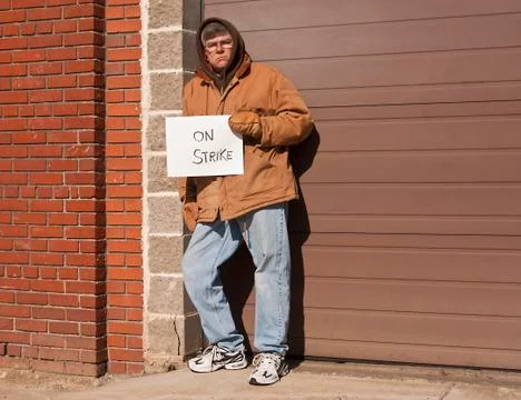 Working man on strike Photos