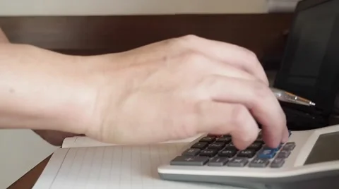 Working man using calculator Stock Footage 58187179