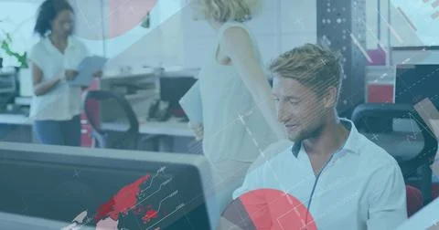 Working man wearing button-down shirt viewing analytics on large monitor in o Stock Photos