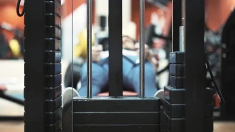 Working mechanism of weight stack in a gym trainer machine Stock Footage 152696602