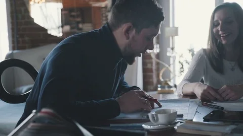 Working meeting: creative man-designer and female assistant 스톡 동영상 75891076