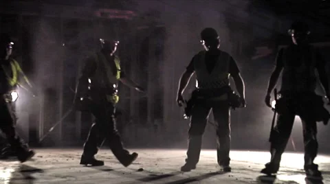 Working men, backlit in construction site. Video stock 49861530