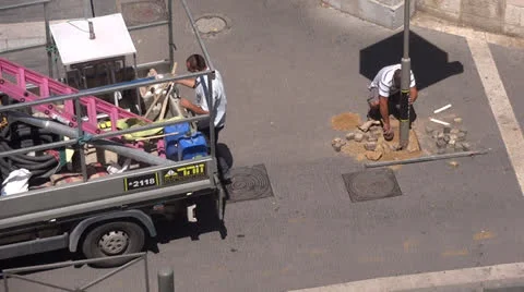 Working men fixing the road Stock Footage 25122366
