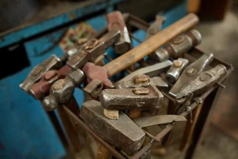 Working metal tools in blacksmith's workshop, close-up, selective focus, nobody Stock Photos