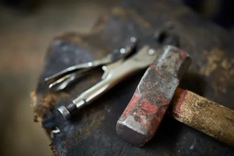 Working metal tools in blacksmith's workshop, close-up, selective focus, nobody Stock Photos