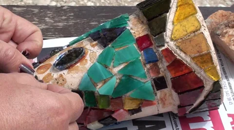 Working on mosaic on bowl Stock Footage 37096047