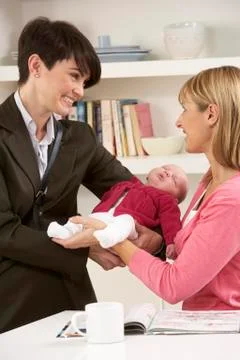 Working Mother Leaving Baby With Nanny Stock Photos