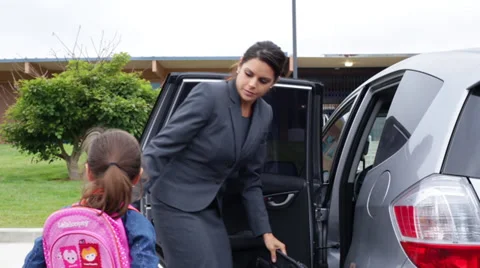 Working Mother Picks Child Up from School Stock Footage 28503545