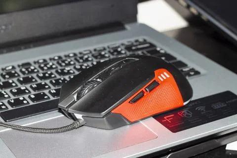 Working mouse on a notebook on vacation Stock Photos