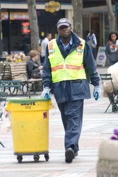 Working moving garbage can Stock Photos