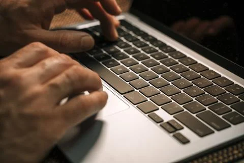 Working on a neon computer keyboard with colored backlighting. Computer vid.. 스톡 사진