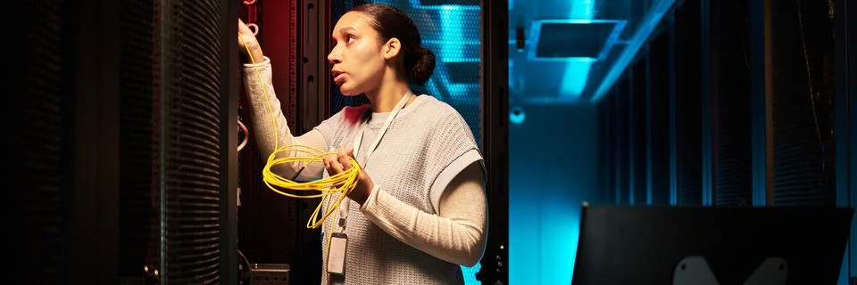 Working On Network Cabling In A Data Center Stock Photos