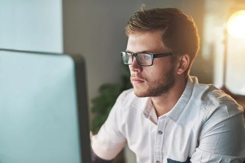 Working at night is a good way to avoid distractions. Cropped shot of a young Stock Photos