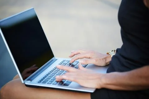 Working with notebook on lap Stock Photos