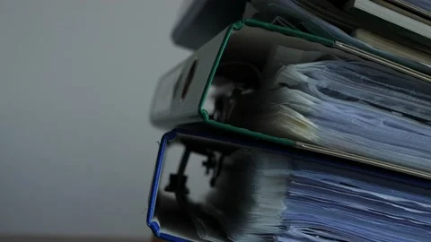 Working in office with documents, binders full of documents Stock Footage 131963618