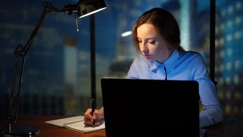 Working in the office, writing in the notebook, using laptop, computer Stock Footage 95401013