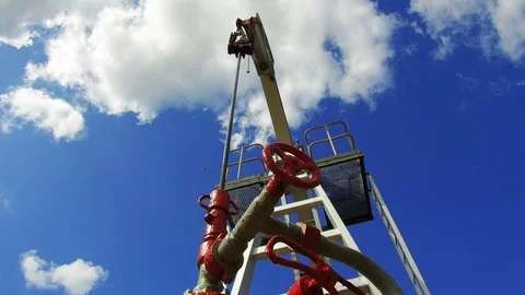 Working oil pump on a background of blue sky. Keep nature Stock Footage 114654571