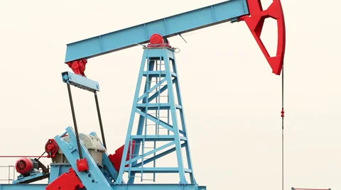 Working oil pump in a field on a bright background. Video stock 66357342