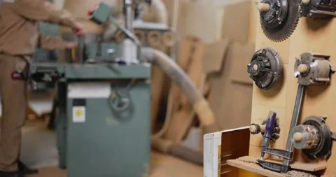 Working on the old grinding machine at the carpentry Stock Footage 147398228