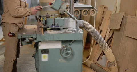 Working on the old grinding machine at the carpentry Stock Footage 147398467