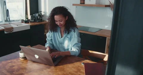 Working online. Beautiful young smiling African American business woman typing Stock Footage 148394160