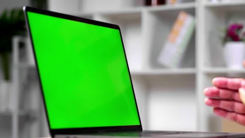 Working online conference using Laptop networking green screen device Stock Footage 153069903