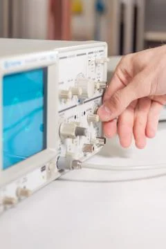 Working with oscilloscope in laboratory Stock Photos