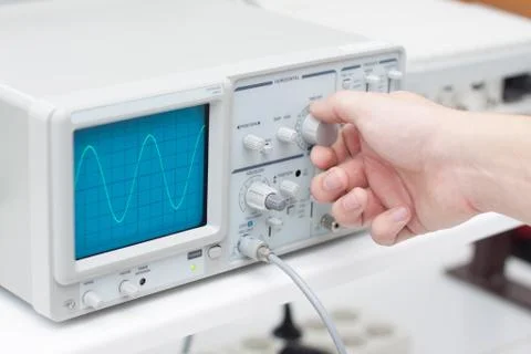 Working with oscilloscope in laboratory Stock Photos